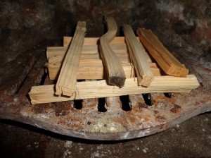 a fire grate with kindling on it