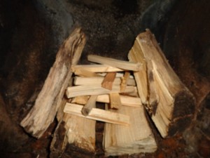 logs and kindling on top