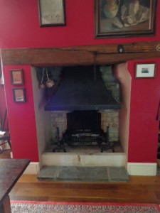 A open grate fireplace with hood