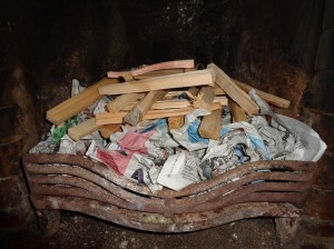 Newspaper with kindling on top