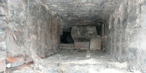 View down chimney showing loose bricks blocking it.