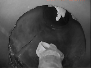 a clay liner with a vertical crack